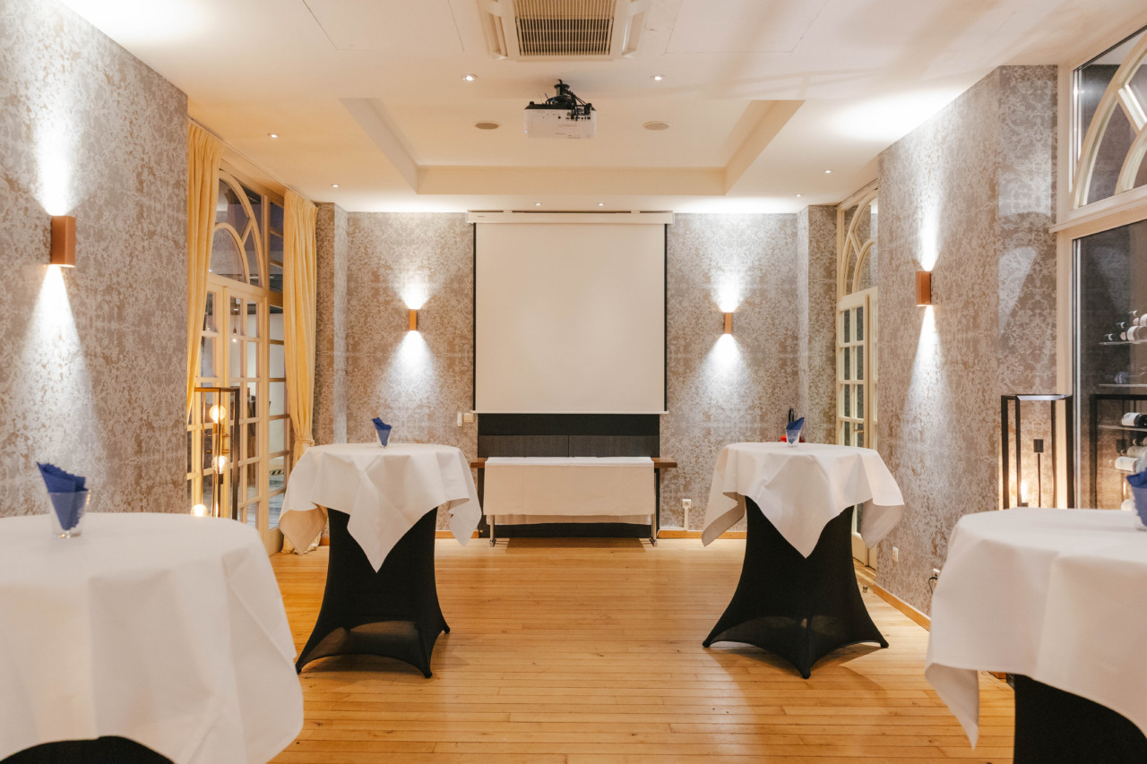 SPA-34 Reception room with screen and cocktail tables at Radisson Blu Balmoral Spa
